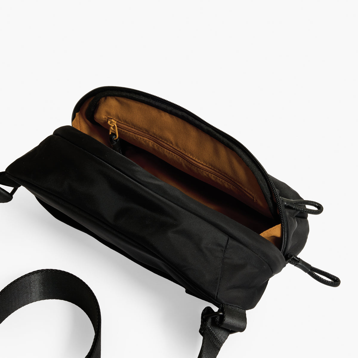Practice Phase Sling Pouch belt back in Eclipse black color interior photo tan lining material